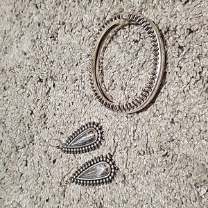 Silver Brighton hinged bangle with drop ear rings,there is no tarnish at all.